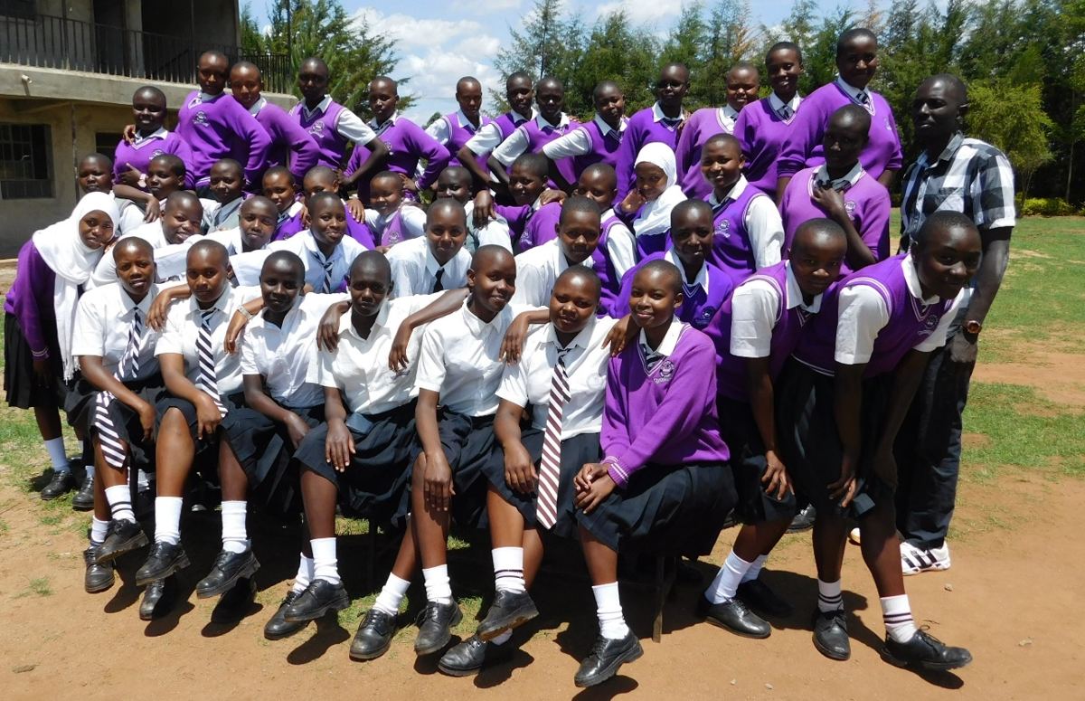 Learners and teachers in a group photo
