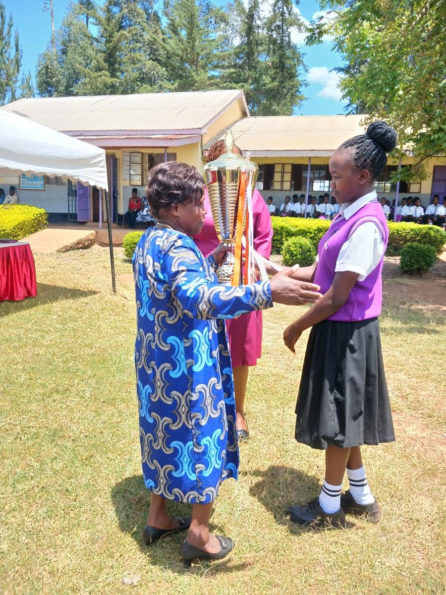 A learner receiving a certificate at the celebration