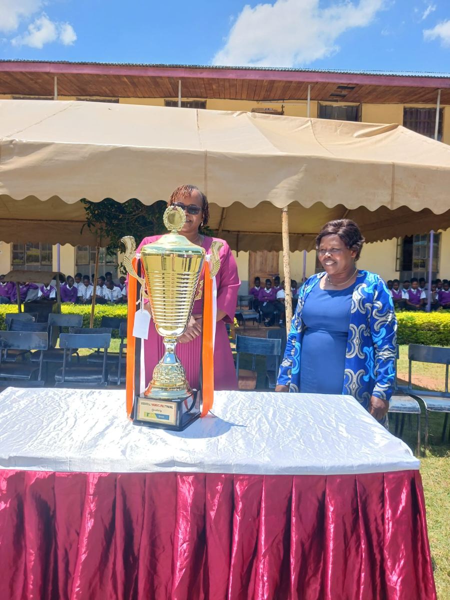 The Music Club trophy on a draped table under the tents
